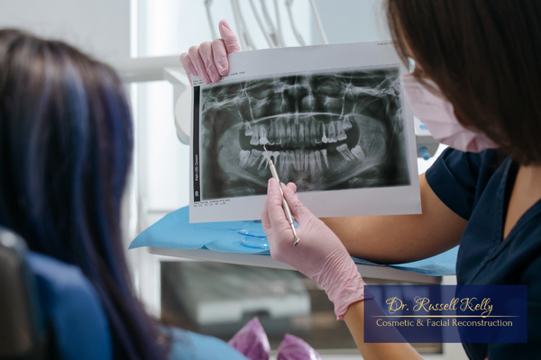 Dr. Russell Kelly, DDS reviewing digital X-rays to detect hidden dental problems in Orange, CA