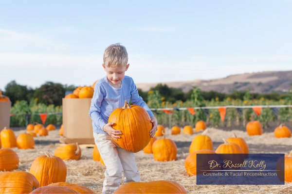 Orange, CA family enjoying fall with healthy smiles after visiting Dr. Russell Kelly